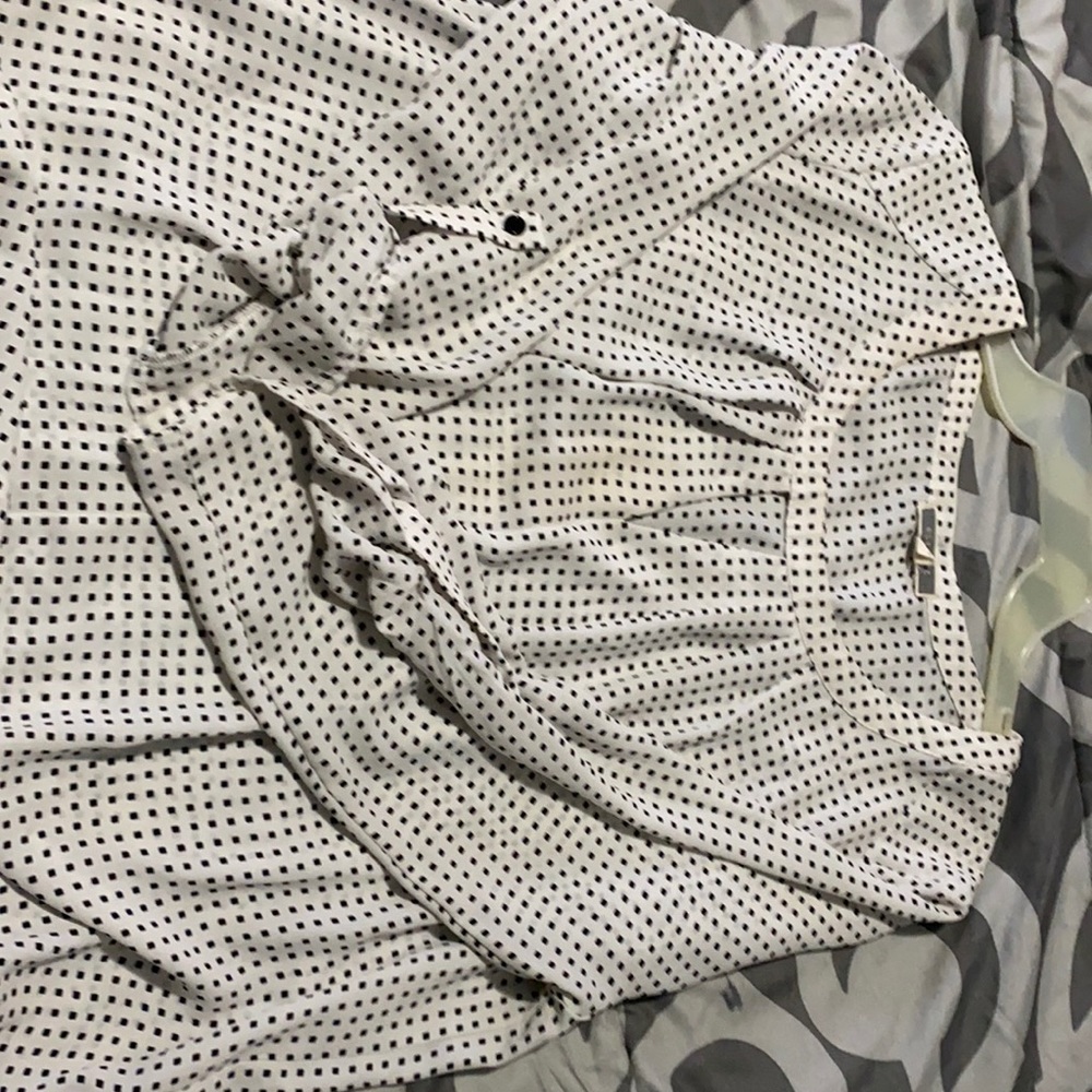 White silky top with black square “polka dots”